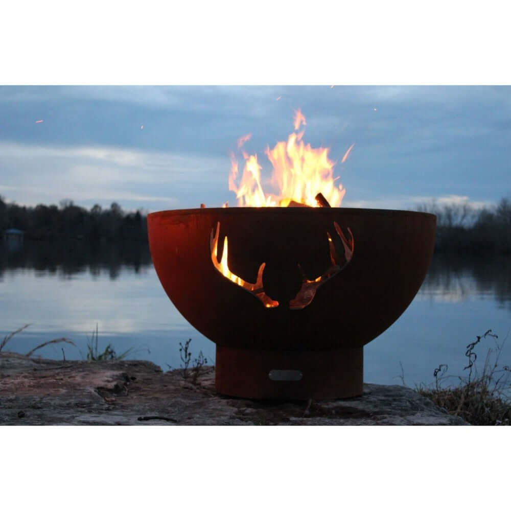 Fire Pit Art Antlers 36-Inch Handcrafted Carbon Steel Gas Fire Pit - next to a lake