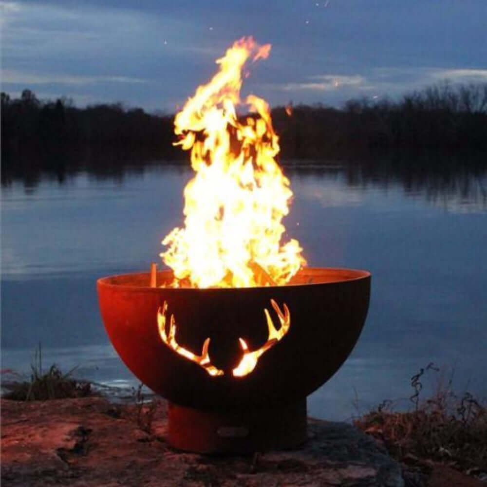 Fire Pit Art Antlers 36-Inch Unique Handcrafted Carbon Steel Fire Pit (ANTLERS) - outdoors, next to a body of water