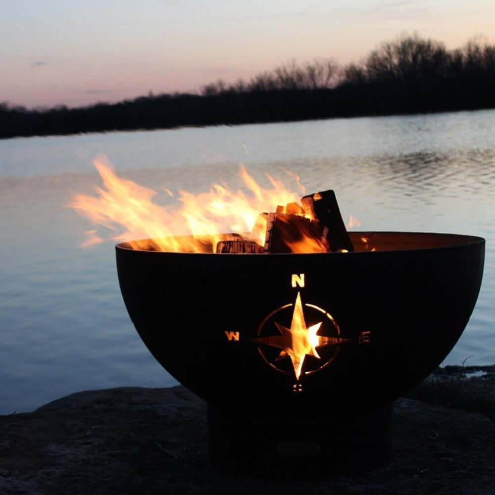 Fire Pit Art Navigator 36-Inch Handcrafted Carbon Steel Fire Pit (NAV) - outdoors next to a river