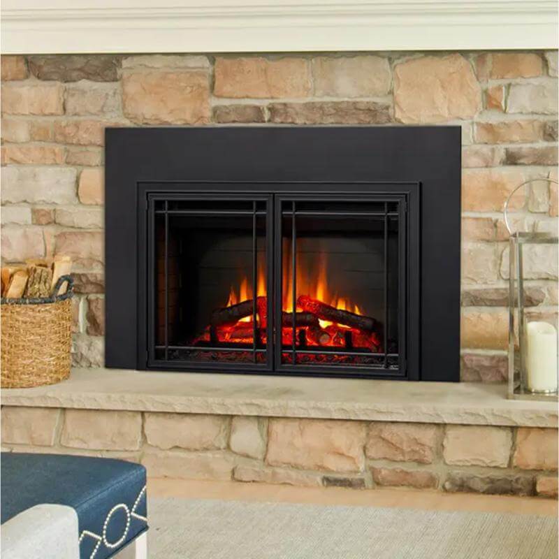 SimpliFire Electric Insert Fireplace - A cozy fireplace with a black finish, set against a rustic stone wall.