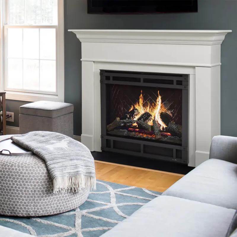 SimpliFire Inception Built-In Electric Fireplace - A cozy living room featuring a fireplace, a couch, and a television.