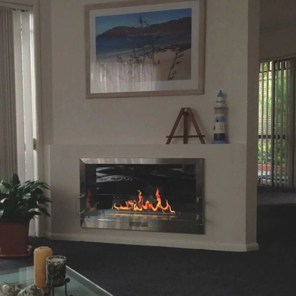 The Bio Flame 38-Inch Firebox DS Built-in See-Through Ethanol Fireplace - Cozy living room featuring a warm fireplace and a comfortable couch
