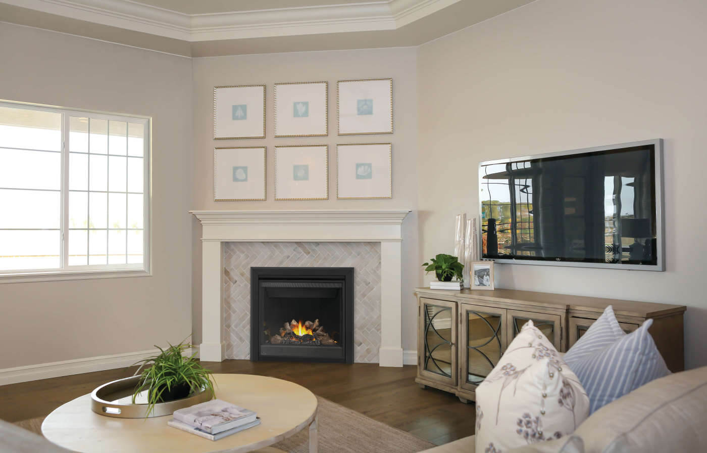 Napoleon Ascent™ X Series Direct Vent Gas Fireplace - Living room with fireplace, television, and decorative elements