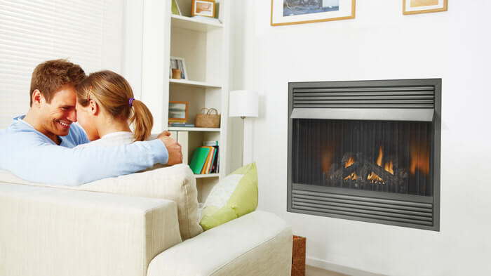 Napoleon Grandville™ VF42 Vent Free Gas Fireplace - Couple sitting by the fireplace together