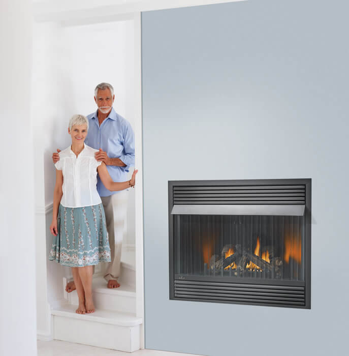 Napoleon Grandville™ VF42 Vent Free Gas Fireplace - Old couple standing at the stairs beside the wall fireplace