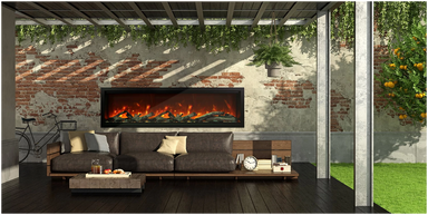 Amantii Symmetry XT Lumina Electric Fireplace - Outdoor living space with a fireplace, sofa, and bicycle against a brick wall.