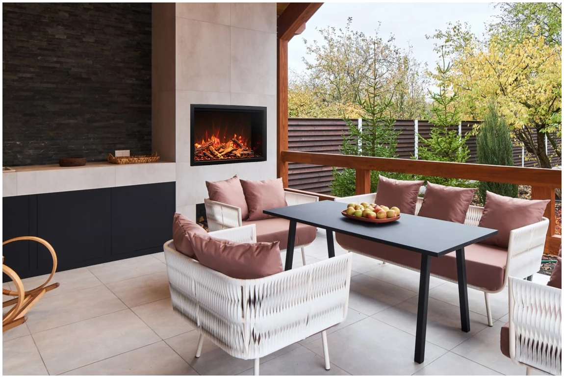 Amantii TRD Lumina Electric Fireplace - Outdoor patio with furniture, fireplace, and view of trees