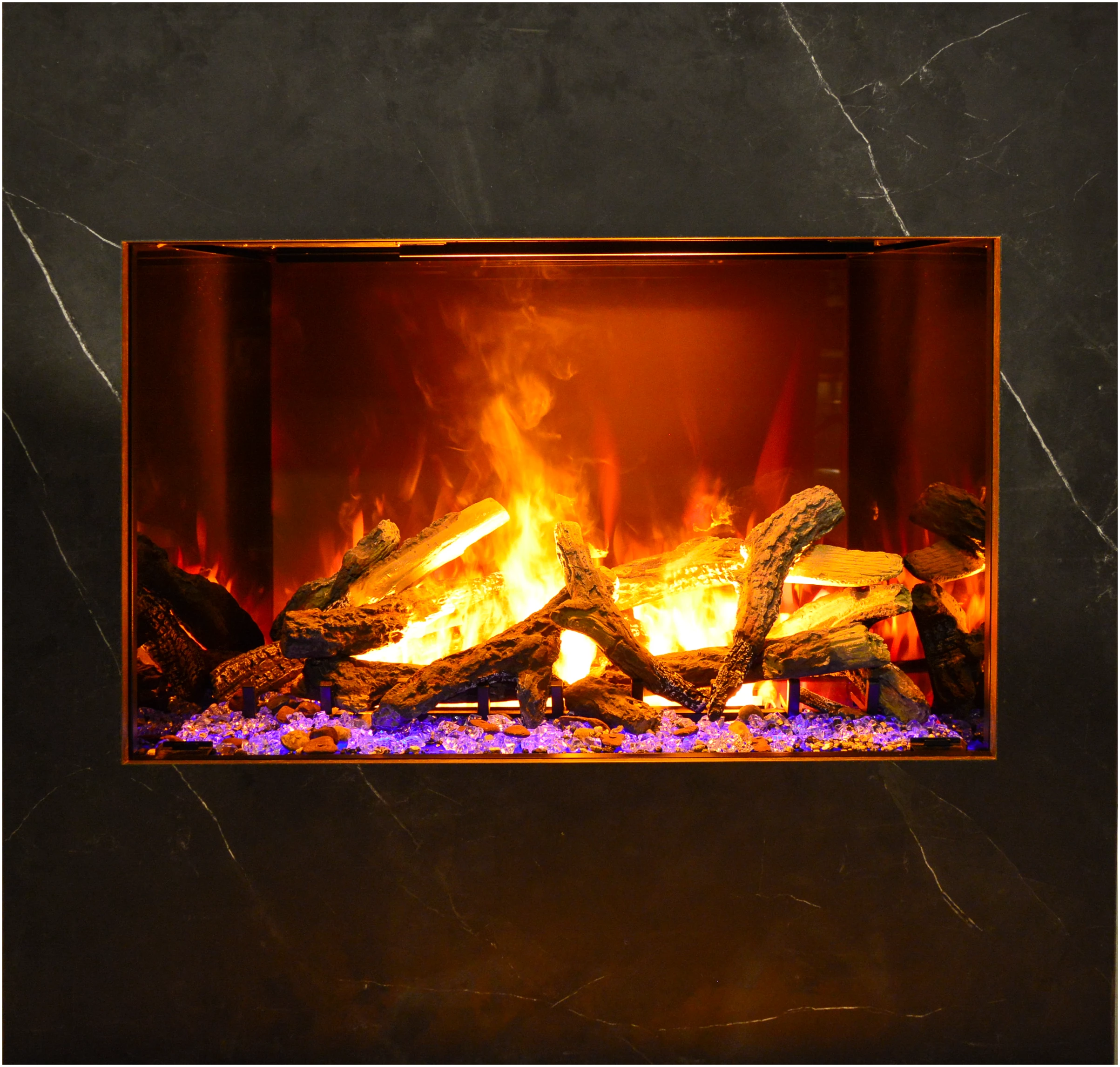 Amantii TRD Signature Series TRD-38-SIG - Faux fireplace with glowing logs and flames on a dark marble background