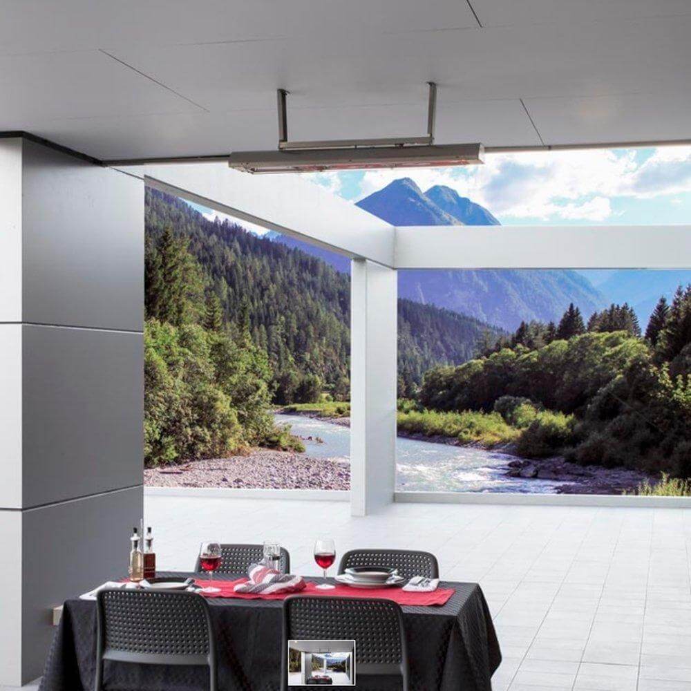 Bromic Cobalt Smart-Heat wall-mounted electric heater in outdoor dining area with scenic mountain views.