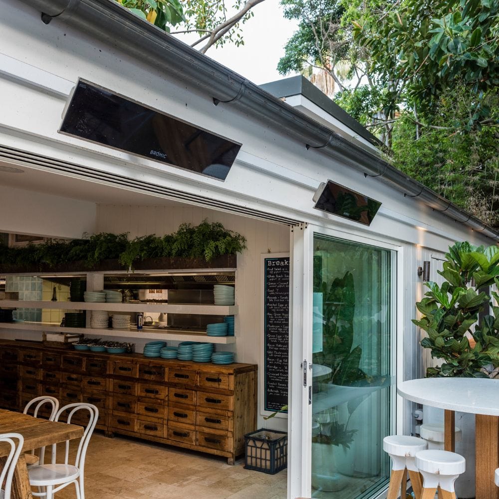 Bromic Platinum 208V electric heaters mounted on a modern restaurant ceiling.