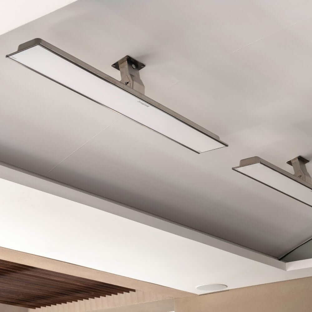 Bromic Platinum Smart-Heat wall-mounted electric heater on a ceiling, providing efficient outdoor heating.