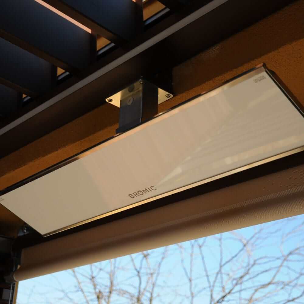 Bromic Platinum Smart-Heat wall-mounted electric patio heater with sleek design, providing efficient heating outdoors.