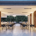 Elegant outdoor dining space featuring Bromic Platinum electric heaters for optimal comfort.