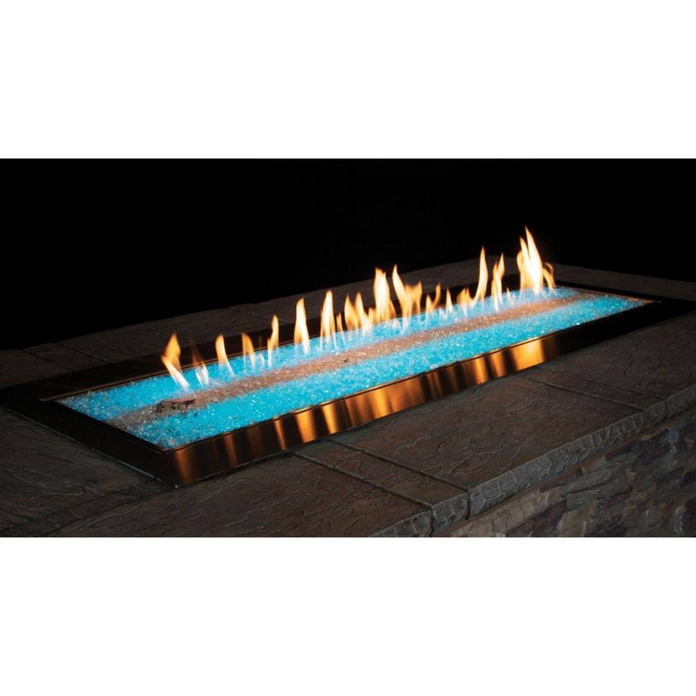 Empire Carol Rose Outdoor Stainless Steel Linear Gas Burner - Modern outdoor fire pit with blue glass and flames on a stone patio