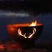 Fire Pit Art Antlers 36-Inch Handcrafted Carbon Steel Gas Fire Pit - next to body of water