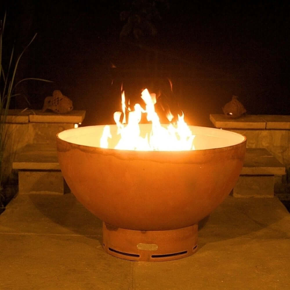 Fire Pit Art Crater 36-Inch Handcrafted Carbon Steel Gas Fire Pit - Fire pit with flames burning at night
