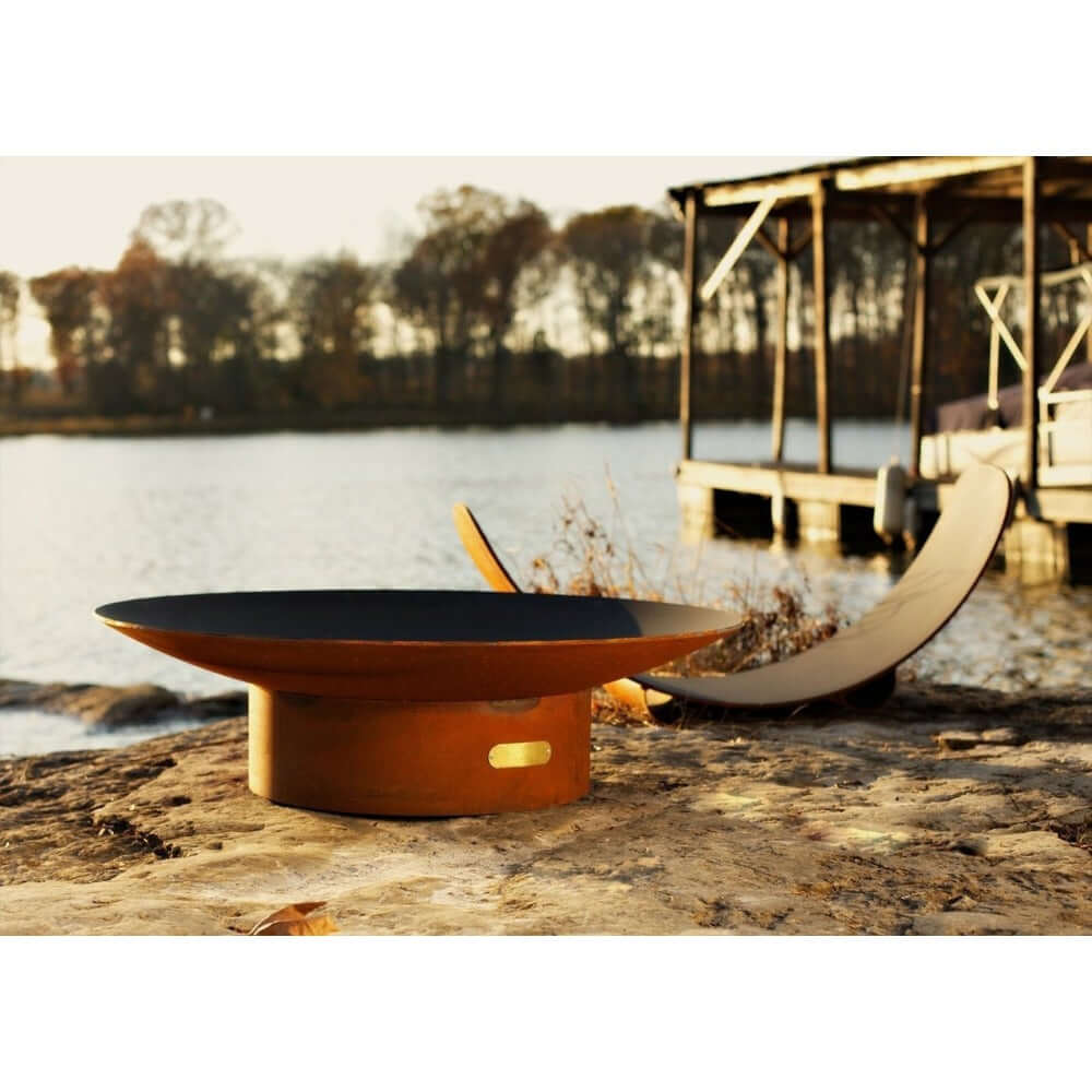 Fire Pit Art Asia 60-Inch Handcrafted Carbon Steel Gas Fire Pit - next to a body of water 