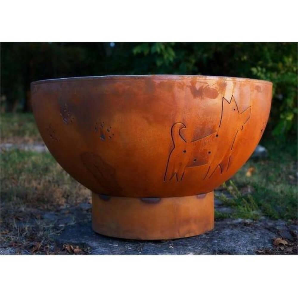 Fire Pit Art Funky Dog 36-Inch Handcrafted Carbon Steel Fire Pit (FDOG) - Rust-colored fire pit with cat designs on a natural background