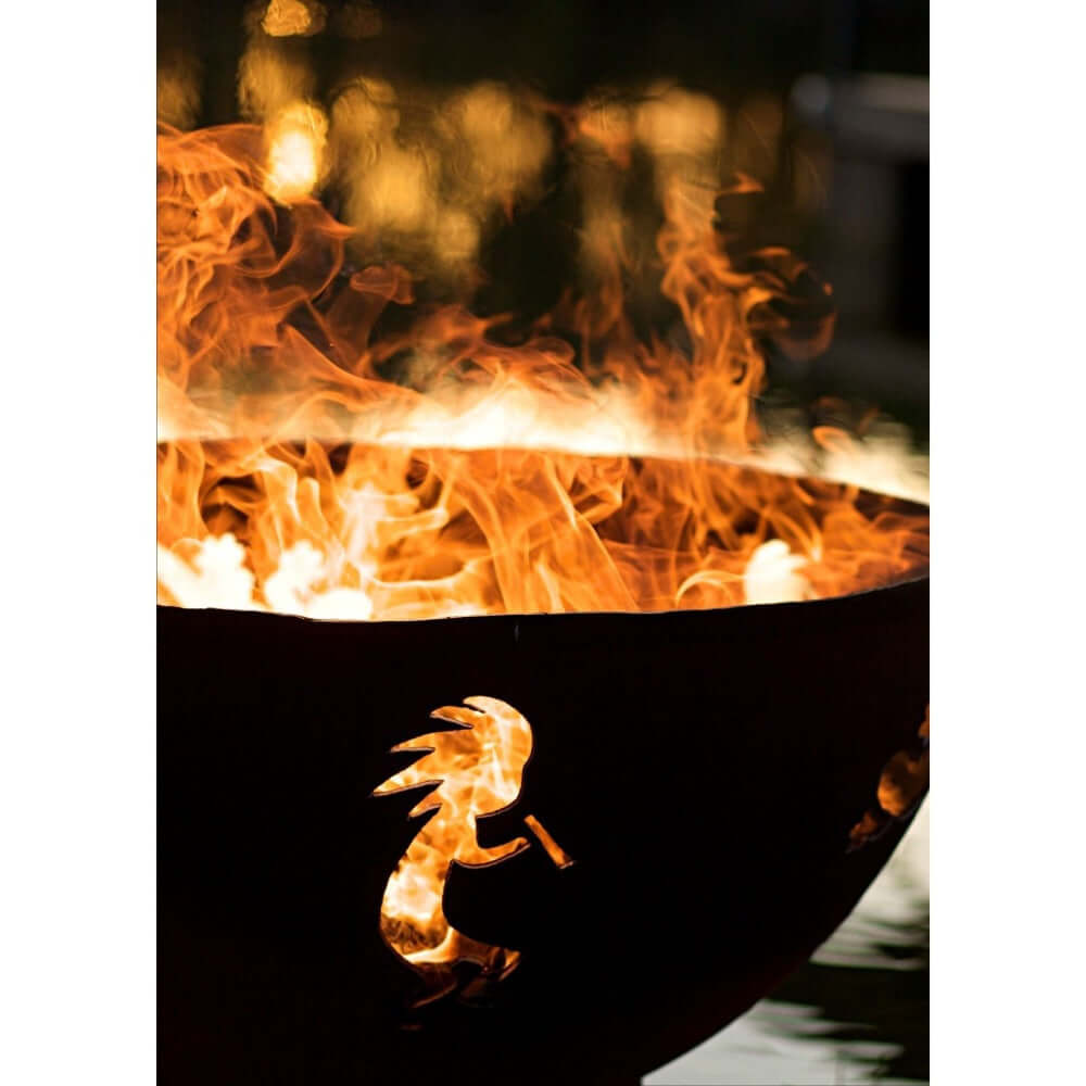 Fire Pit Art Kokopelli 36-Inch Handcrafted Carbon Steel Fire Pit (KO) - Fire pit with flames and a dragon design on a dark background
