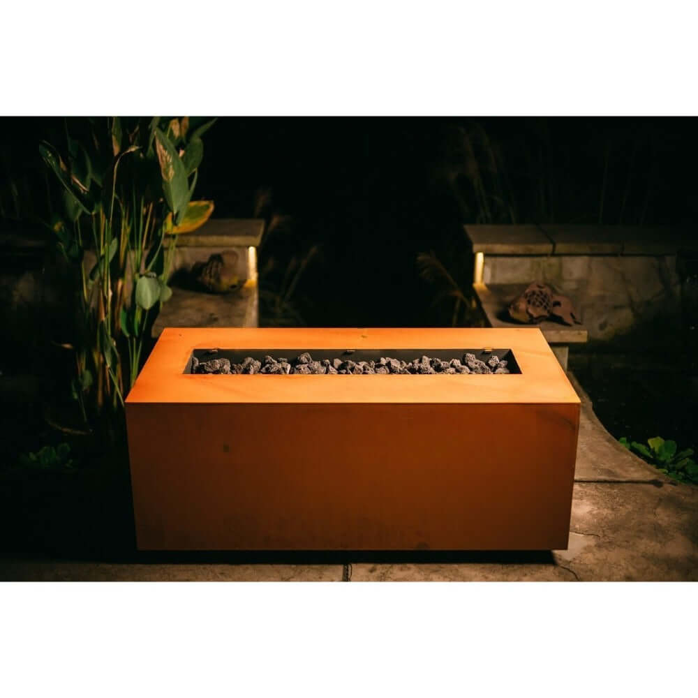 Fire Pit Art Linear 36-Inch Handcrafted Carbon Steel Gas Fire Pit - Rectangular fire pit table with glowing embers in a dark outdoor setting