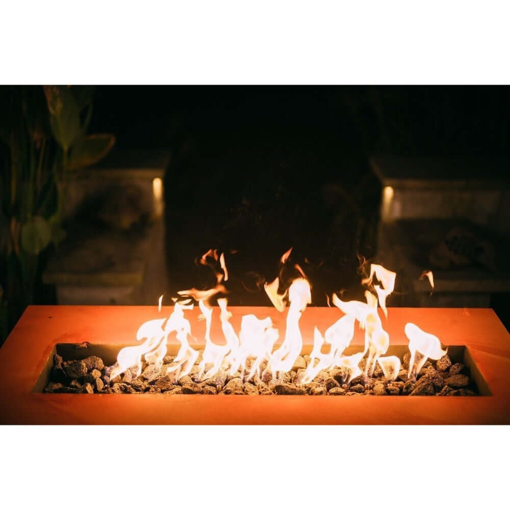 Fire Pit Art Linear 36-Inch Handcrafted Carbon Steel Gas Fire Pit - Fire pit with flames and rocks on a dark background