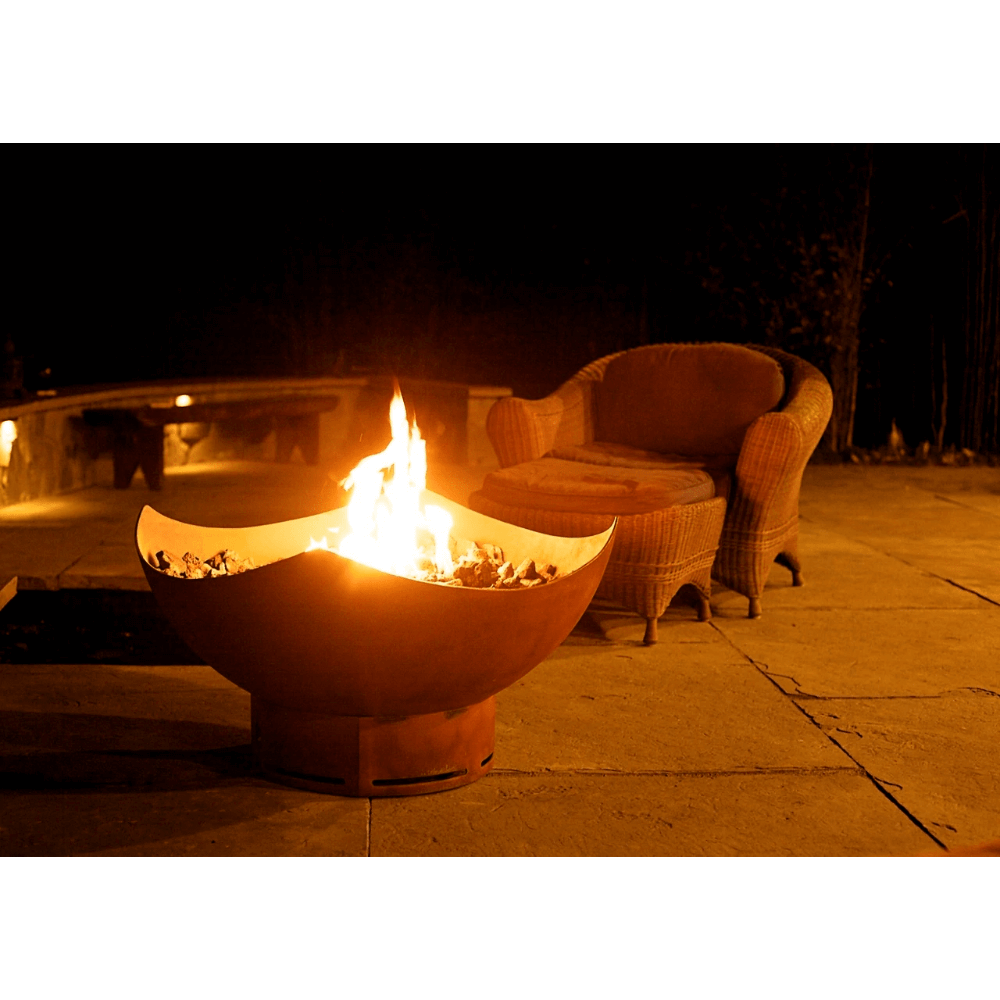 Fire Pit Art Manta Ray 36-Inch Handcrafted Carbon Steel Gas Fire Pit - Fire pit with flames on a patio at night