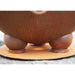Fire Pit Art Nepal 41-Inch Handcrafted Carbon Steel Gas Fire Pit - Wooden bowl with a textured surface on a stone surface