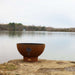 Fire Pit Art Tropical Moon 36-Inch Handcrafted Carbon Steel Gas Fire Pit - next to a lake 