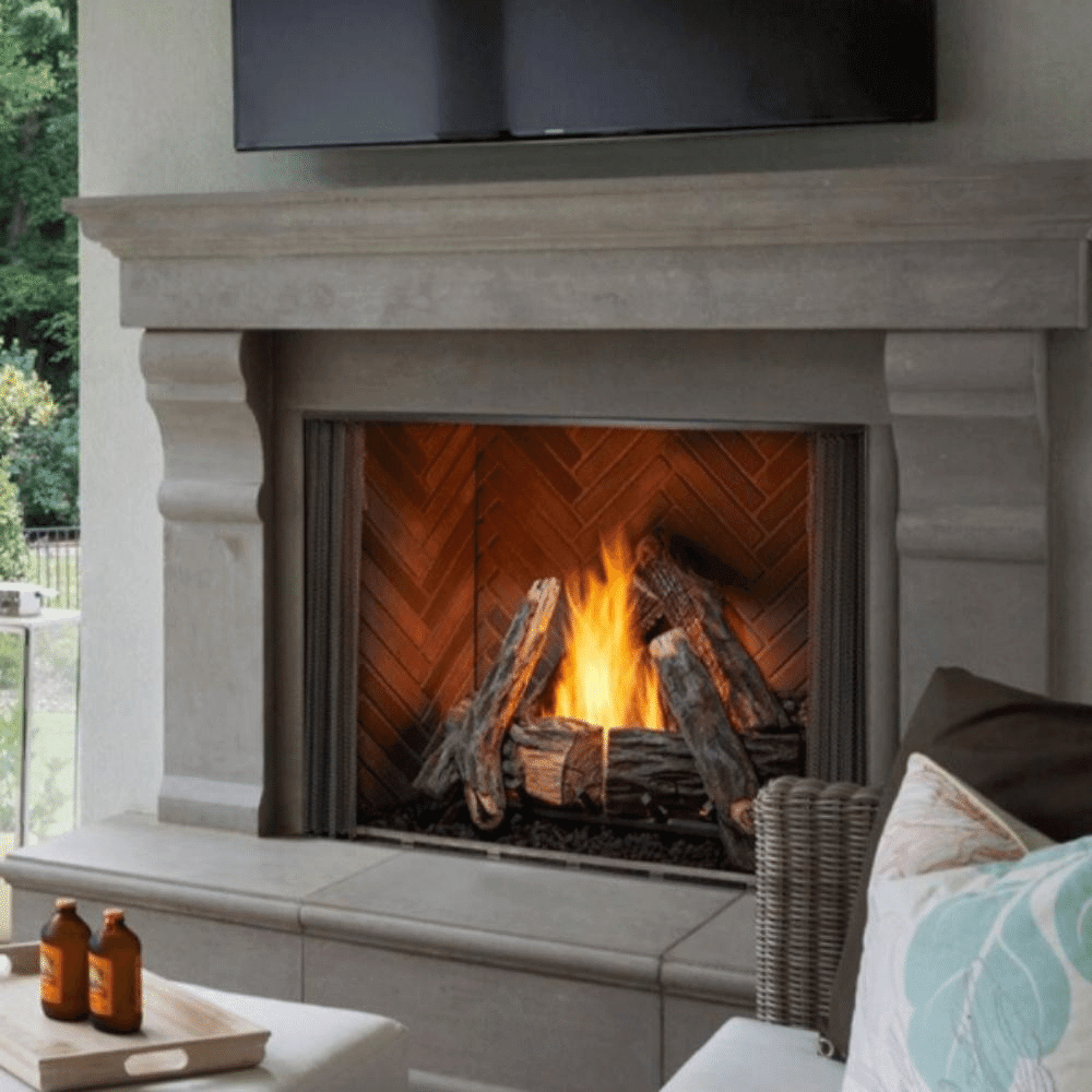 Vent-free outdoor natural gas fireplace with realistic logs and flames in a stylish gray stone mantel.