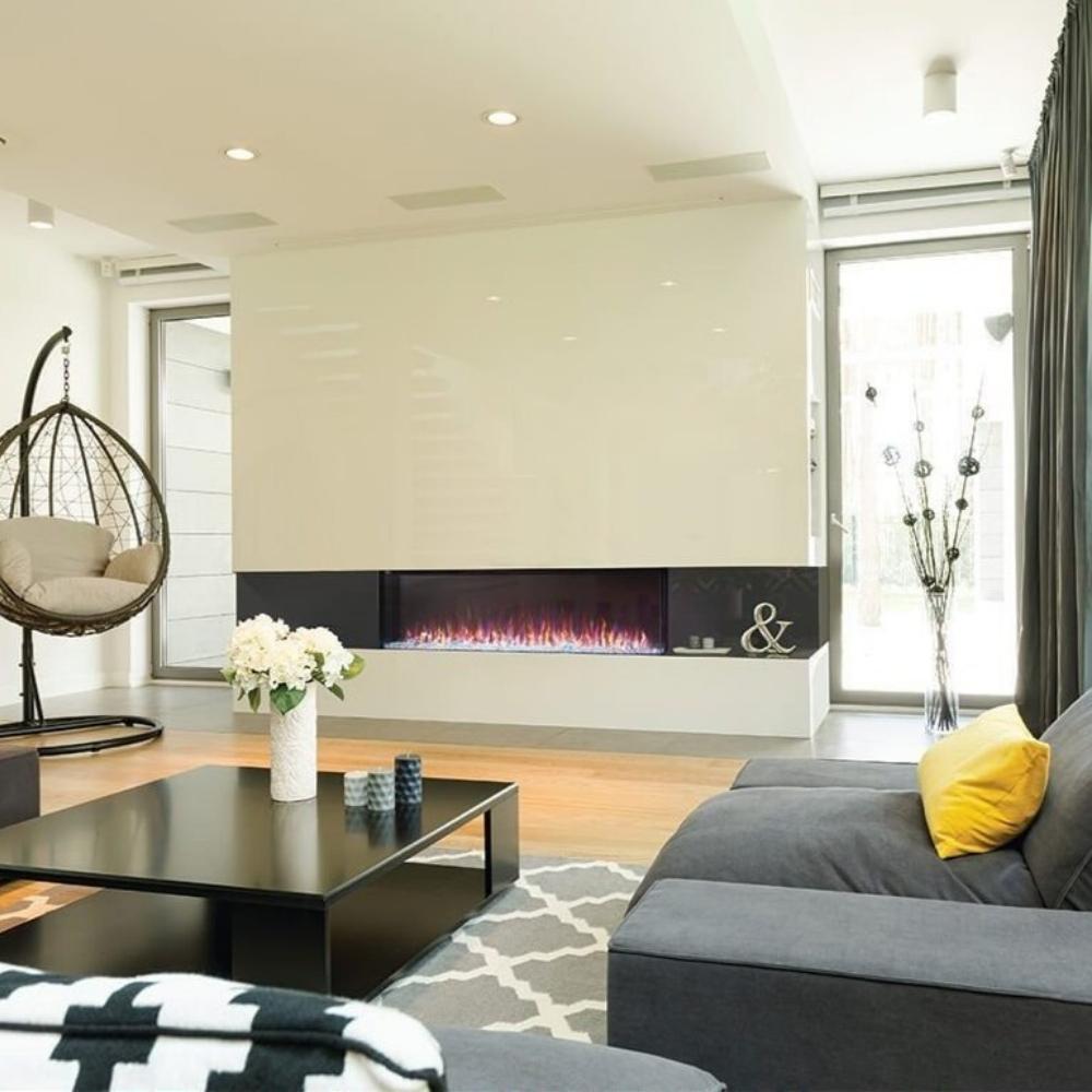 Modern living room featuring the Napoleon Trivista Primis 3-sided built-in electric fireplace with vibrant multicolored flames.
