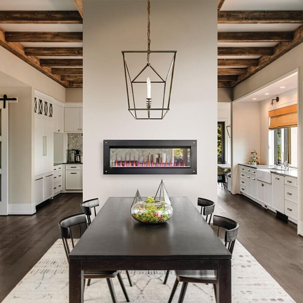 Modern dining area featuring Napoleon CLEARion Elite see-through electric fireplace between two rooms.