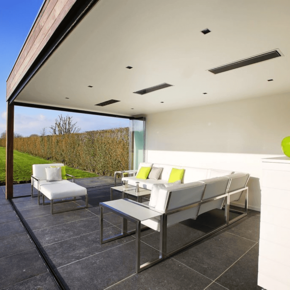 Sleek outdoor seating area featuring modern furniture and integrated electric heaters for comfortable relaxation.