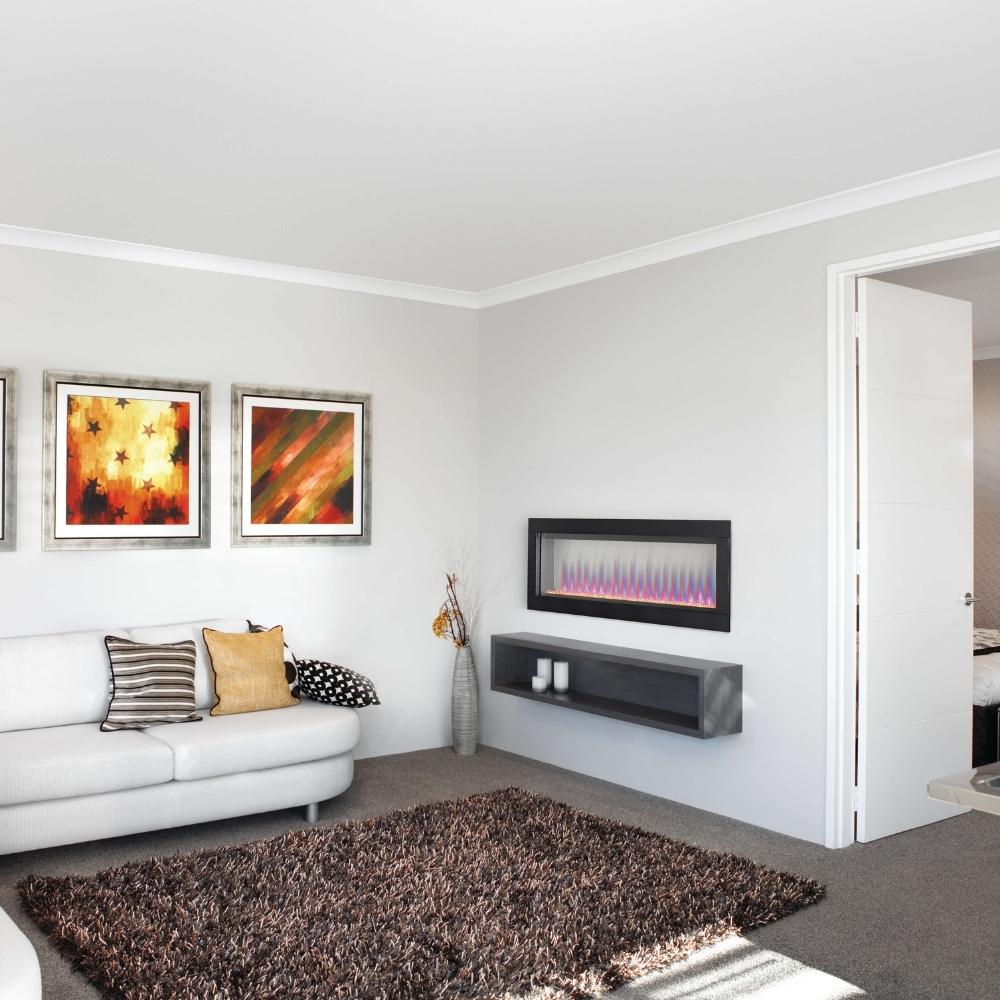 Modern living room featuring a Napoleon CLEARion Elite two-sided electric fireplace, cozy decor, and vibrant artwork.