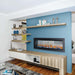 Modern interior featuring Napoleon CLEARion Elite see-through electric fireplace enhancing dual room ambiance.