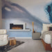Modern wall-mounted electric fireplace in stylish bedroom decor with elegant furnishings and calming color palette.