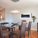 Stylish dining area featuring a Napoleon Cara Elite wall-mounted electric fireplace, enhancing ambiance and comfort.