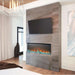 Modern living room featuring a Napoleon Trivista 3-sided electric fireplace with multicolored flames and TV above.