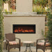 Remii Extra Tall Indoor/Outdoor Frameless Built-in Electric Fireplace - A charming patio scene with a glowing fireplace and two chairs