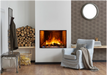 Amantii TRD Signature Series TRD-38-SIG - Living room with a fireplace, armchair, and stacked logs.