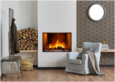 Amantii TRD Signature Series TRD-38-SIG - Living room with a fireplace, armchair, and stacked logs.