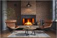 Amantii TRD Signature Series TRD-38-SIG - Cozy living room with a fireplace, brown leather chairs, and a wooden coffee table.
