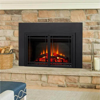 SimpliFire Electric Insert Fireplace - A cozy fireplace with a black finish, set against a rustic stone wall.