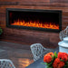 SimpliFire Forum Outdoor Electric Fireplace - An inviting fireplace accompanied by a table and chairs.