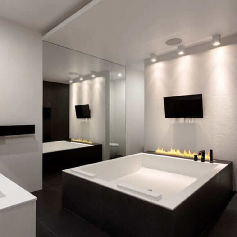 The Bio Flame 38-Inch Ethanol Fireplace Burner, Indoor/Outdoor - A sleek modern bathroom featuring a cozy fireplace