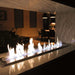 The Bio Flame 38-Inch Ethanol Fireplace Burner, Indoor/Outdoor - A sleek modern fireplace with vibrant flames dancing in the center