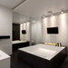 The Bio Flame 38-Inch Smart Remote Controlled Ethanol Burner -  sleek modern bathroom featuring a cozy fireplace and a spacious bathtub