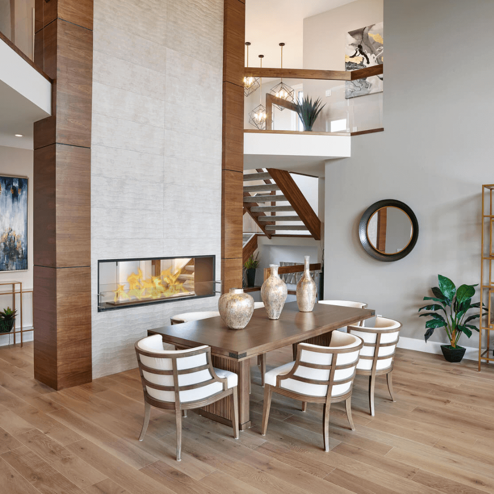 The Bio Flame 60-Inch Smart Firebox DS - See-Thru Ethanol Fireplace - A sleek dining room featuring a cozy fireplace and elegant wood floors