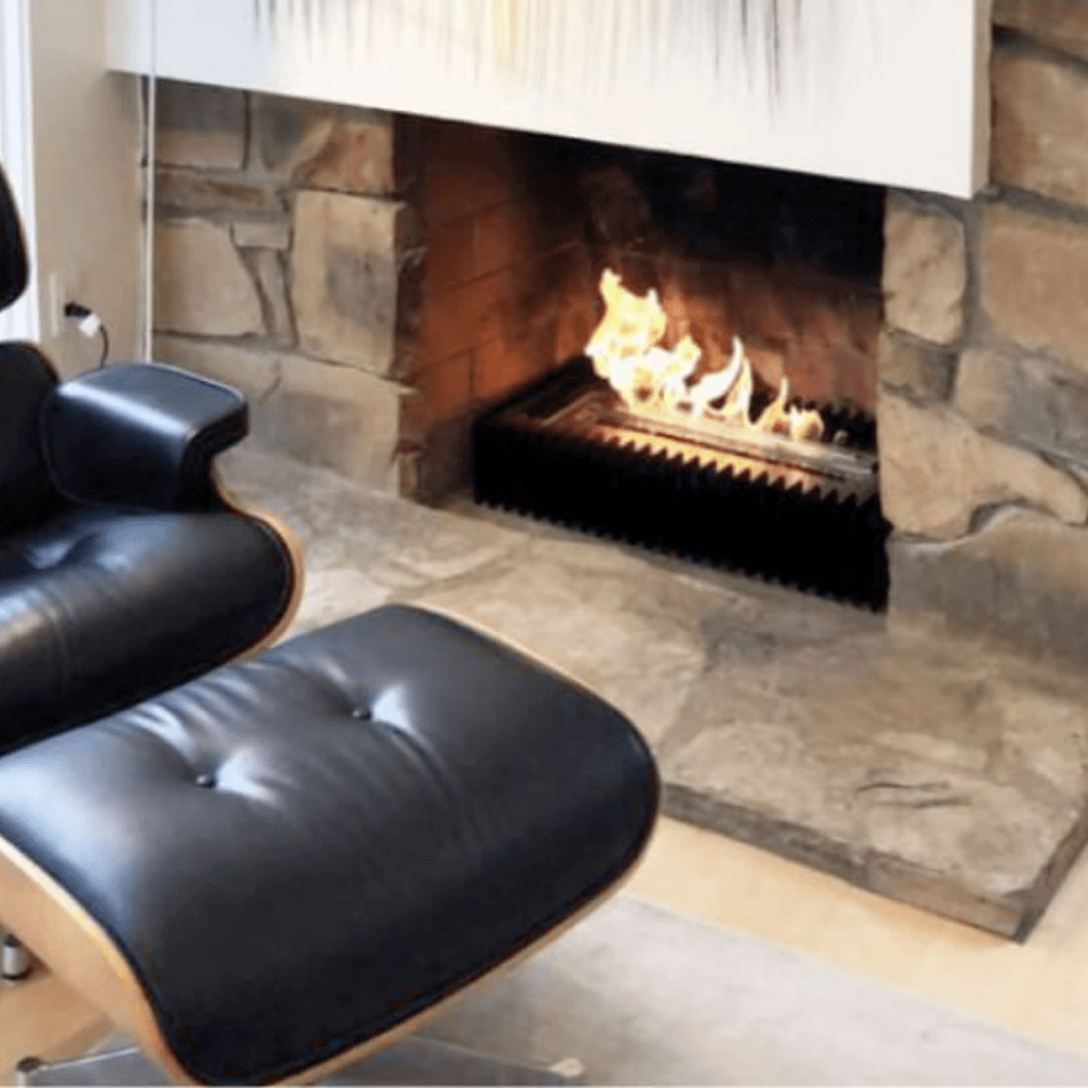 The Bio Flame Fireplace Insert Kit 13-Inch Ethanol Burner With Grate - A sleek black leather chair and matching ottoman