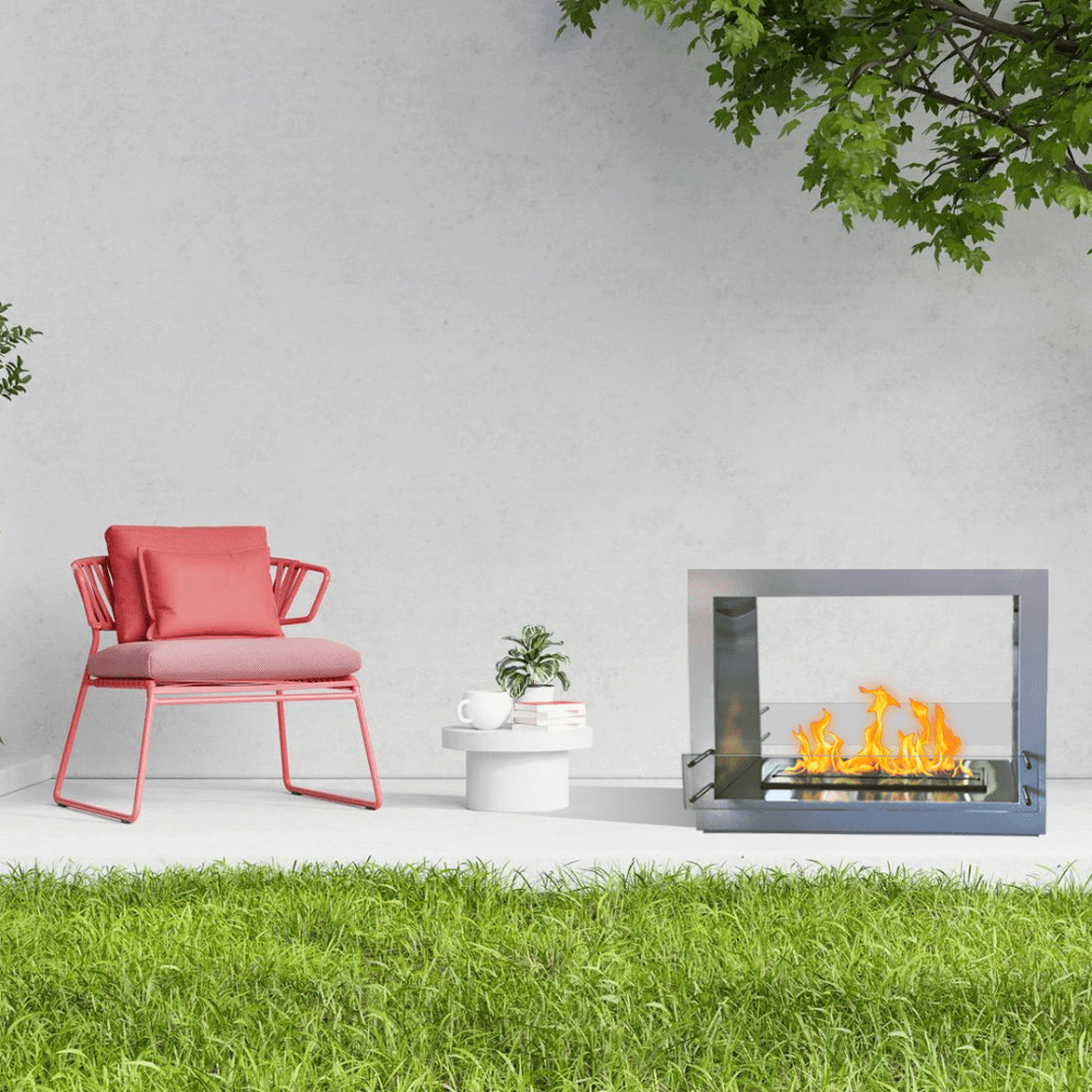 The Bio Flame Sek XL 53-Inch Free Standing See-Through Ethanol Fireplace - A modern outdoor fireplace radiating warmth, paired with a vibrant pink chair