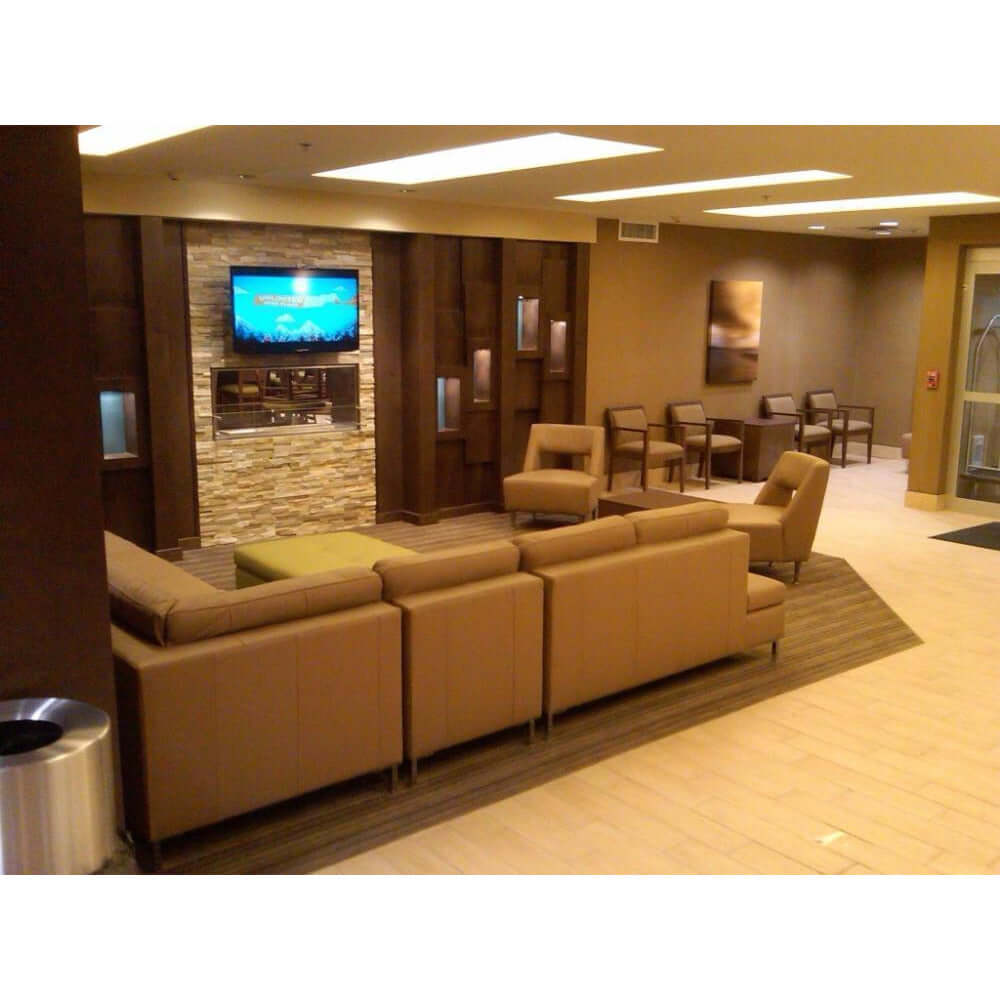 The Bio Flame 60-Inch Smart Firebox DS - See-Thru Ethanol Fireplace - Spacious lobby featuring cozy couches and a large flat-screen TV